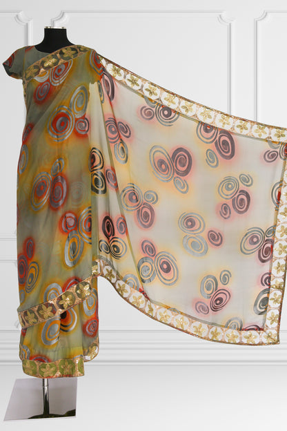 Olive Green Saree with Vibrant Swirls and Embroidered Gold Border